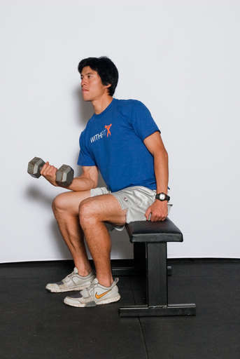 Flex your wrists up as far as the can go, curling the weight up.