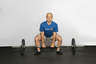 Bend at the knees and waist to grasp the barbell using an overhand or alternating grip. Ensure that your back is arched.
